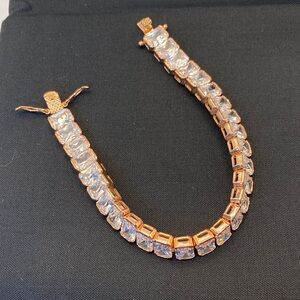 Elegant Nolan Miller Rose Gold Bracelet with Crystal Clear Gemstones